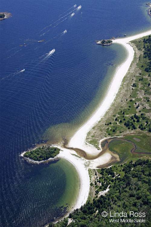 Another view of the fishing boats motoring by the Wombemkak and Carter's beaches.