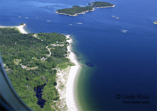 Fishing boats passing by Spectacle Island (top) and SouthWest Beach (middle bottom).