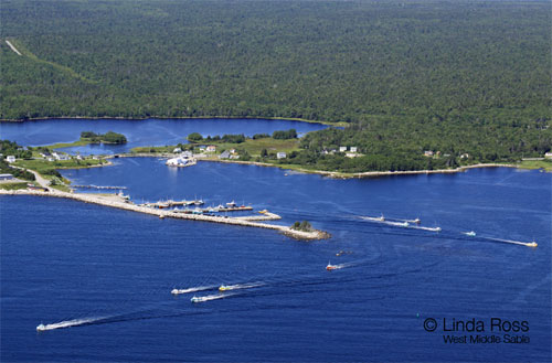 Fishing boats leaving the wharf heading for Port Mouton Island