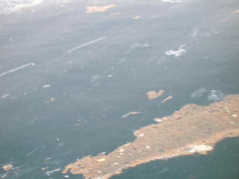 Brown flaoting waste from Fish Farm Aug 5, 2012