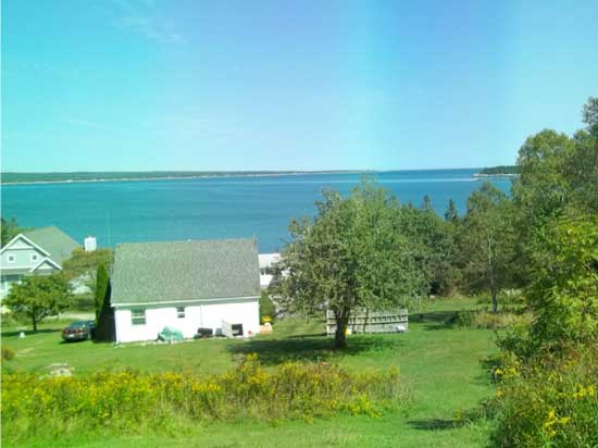 Oily slick emanating from fish farm and drifting towrds Summerville Beach, NS Sep 11, 2012