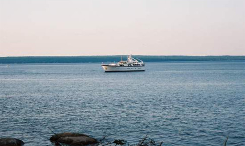 Large motor boat cruising in the Bay